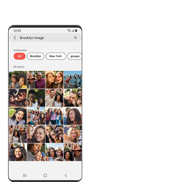 מסך ביישום גלריה בטלפון Galaxy מציג תמונות עם חברים במהלך טיול לברוקלין לאחר חיפוש "תמונות טיול ברוקלין" באמצעות תכונות שליטה Galaxy של ביקסבי.