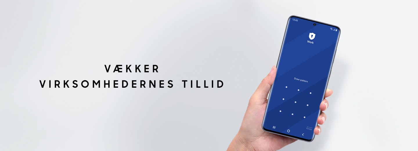 A hand holding Galaxy S20 Ultra with the Pattern entry interface onscreen and text saying Trusted for business