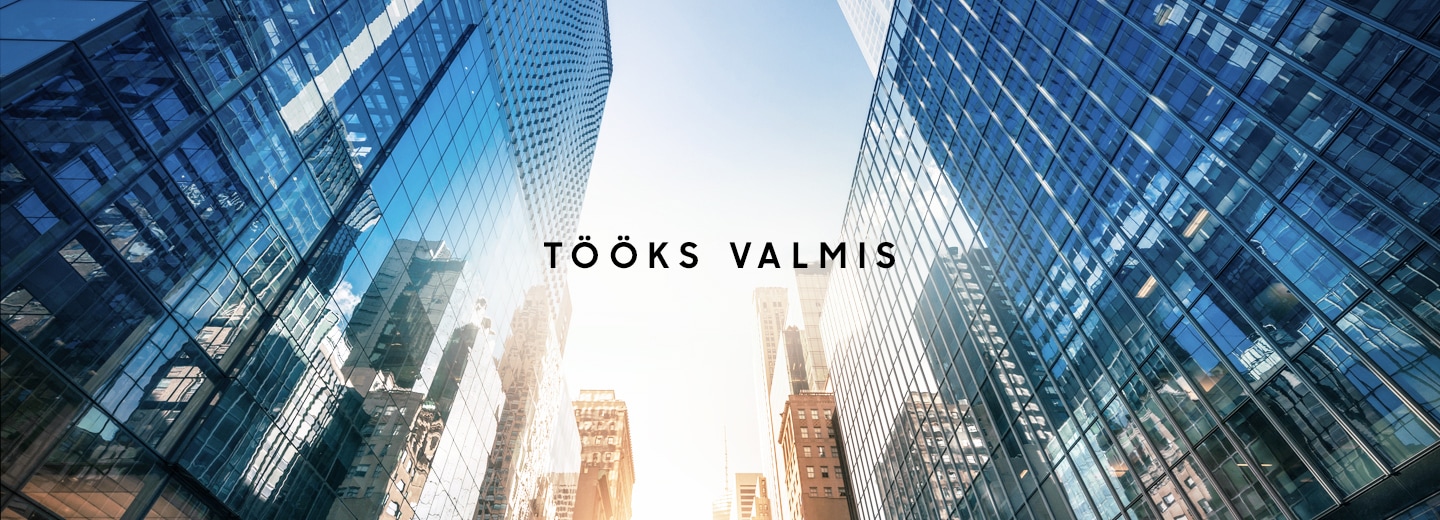 A skyward facing photo between multiple glass skyscrapers with text overlaid that says Ready for business