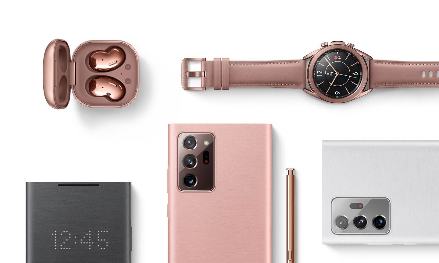 A flat lay of Galaxy Buds Live in Mystic Bronze, Galaxy Watch3 in Mystic Bronze, the LED View Cover in Black, Galaxy Note20 Ultra in Mystic Bronze seen from the rear with the S Pen next to it.