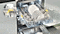 Shows how you can simply adjust the settings of the middle rack. Levers on its sides let you raise the middle rack by 50mm. There is also a switch that lets you raise or lower the tines on the left-hand side of the rack to accommodate different items, like cups or glasses. When you push the switch left the tines are at a low angle. When you push the switch right the tines are raised up.