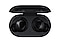 A pair of black Galaxy Buds inside an open charging case