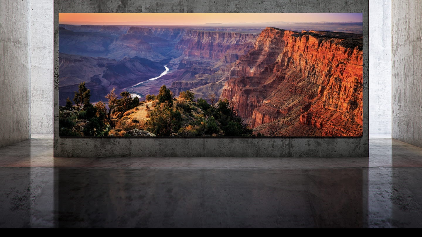 Three alternates of The Wall - one in a black background and other two in a luxury residence setting with screen showing a grand view of a plain and a wall frame template