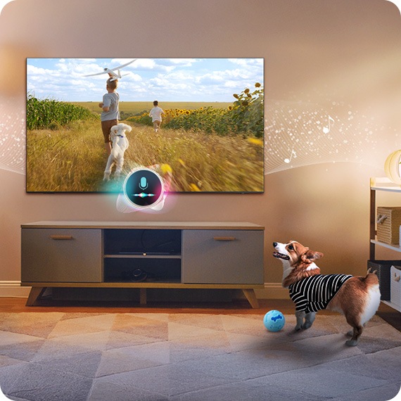 In a living room, a Samsung Smart TV plays content after automatically detecting the dog's barking sounds via Pet Care.