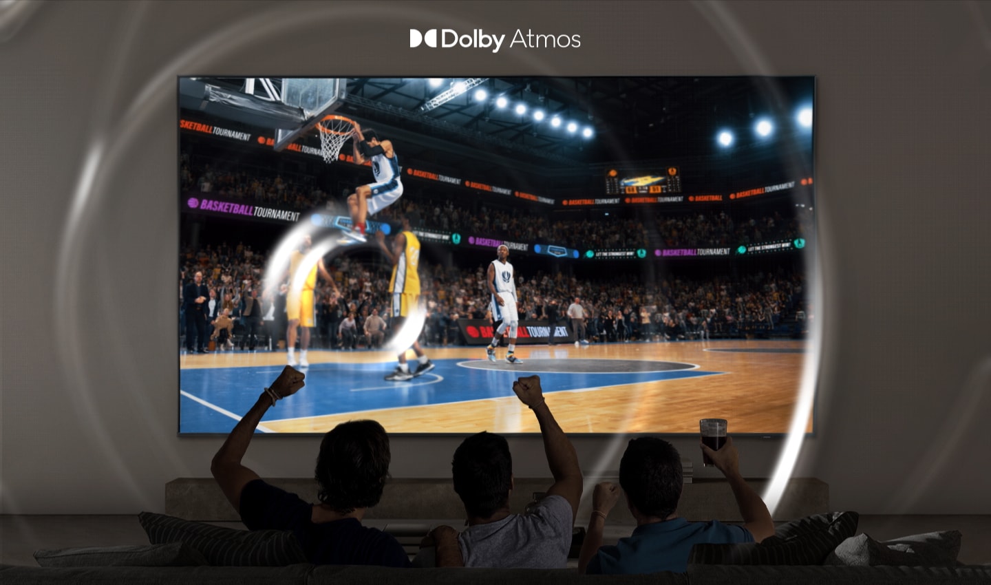 Sports fans excitedly watch a baseball game on a Samsung Super Big TV with Dolby Atmos surround sound.