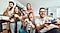 With a big screen TV which is the best size tv for gaming, a group of friends is having fun while playing a game on a game console.