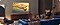 A man sitting in a living room watching Samsung TV