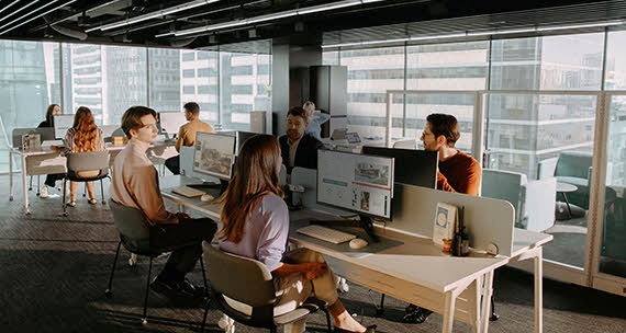 Several people are working in the office.