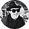 Joe Wright is smiling, wearing a fedora and sunglasses.
