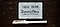 Zu sehen ist ein weisser Zettel wo New Year Resolutions steht und ein Stift.