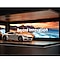 car parked in front of video wall