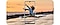 Samsung Galaxy A53 capturing a woman jumping with a sunset in the background