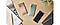 3 Samsung Galaxy Note20 smartphones on a table in mystic green, mystic bronze and mystic black colours