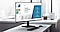 An office setup with a monitor displaying presentation slides.