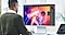 A man editing an image on the monitor.