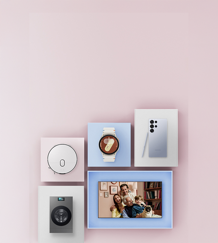 A warm family moment is shown with parents, a child, and a dog smiling together on a TV screen. Surrounding the screen are Samsung products displayed in box-like frames on a soft pink background — including the Galaxy Watch7, Galaxy S25 Ultra, Bespoke AI Steam, and BESPOKE AI Combo.