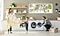 A mother, father and a young son are finishing a load of laundry. The mother and son are joyfully folding a yellow blanket while the father is kneeling by the Samsung QuickDrive™, taking out finished laundry.