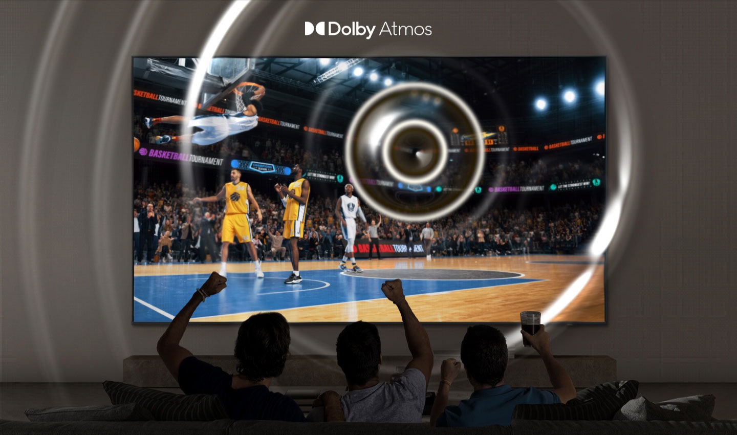 Sports fans excitedly watch a baseball game on a Samsung Super Big TV with True Dolby Atmos surround sound.