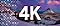 Shown is a nighttime view of a snowy mountain peak and a starry sky above it. In varying degrees of transparency, a checkerboard-like pattern of squares can be seen, illustrating high quality pixels. And the word '4K' is overlaid on.