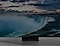A big screen TV is displaying a majestic waterfall, highlighting the impressive scale of the screen.