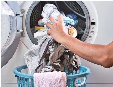 Take clean clothes out of the washer