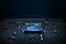1 model of Samsung Exynos 980 in black and blue against a background shaped like a motherboard