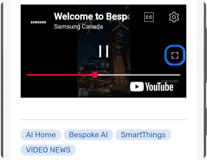 YouTube video with the full screen button highlighted on a Samsung Galaxy phone.