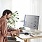 A man is working remotely from home. He has a monitor and tablet on his desk, which helps him be more productive. He is editing a report on his tablet.