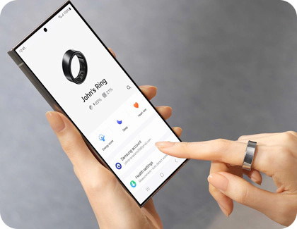 Person checking the battery level of a Galaxy Ring using the Galaxy Wearable app on a smartphone.