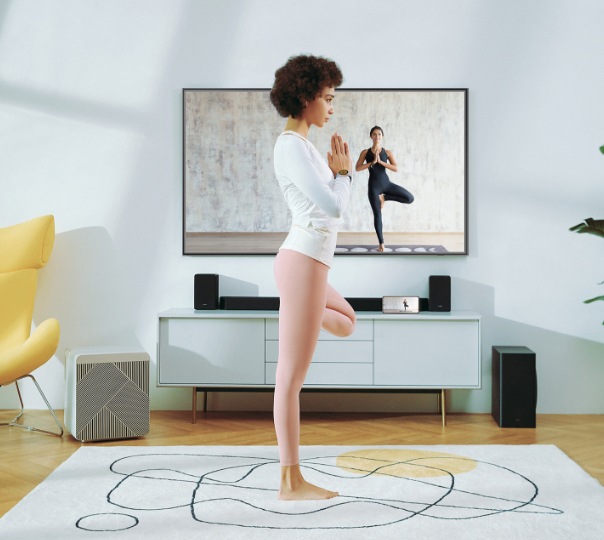 A girl doing yoga in the living room.