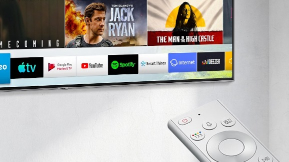 An older Samsung TV with Smart Hub interface and One Remote in view.