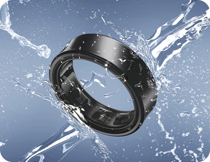 Samsung Galaxy Ring in black, splashed with water to demonstrate its water resistance.