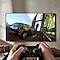 A video game controller shooting controller action symbols at a QLED TV mounted on the wall