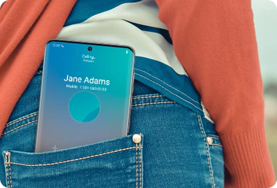 A Galaxy phone in a back pocket showing an incoming call screen.