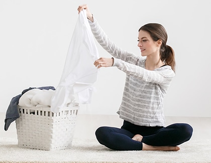 Person sorting laundry