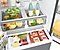 Interior of a Samsung fridge showing neatly organized fresh and packaged food.