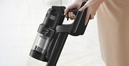 There is a closeup of a person holding a Bespoke Jet™ AI.