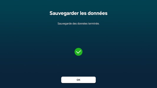 Écran de confirmation indiquant 'Sauvegarde des données terminée' avec un icône de coche verte et un bouton 'OK'.