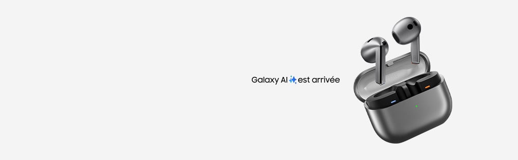 A pair of silver Galaxy Buds3 earbuds hovering above the open case that is tilted toward the left.  The text 'Galaxy AI is here' with a Galaxy AI icon can be seen.