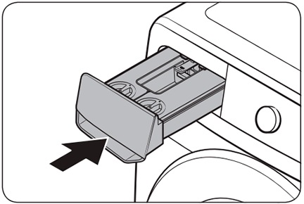 Puesta del cajón del detergente en la lavadora