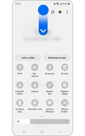 Sākuma ekrāna skats, kurā redzama lejup pavelkamā ikona un ātrās piekļuves panelis.