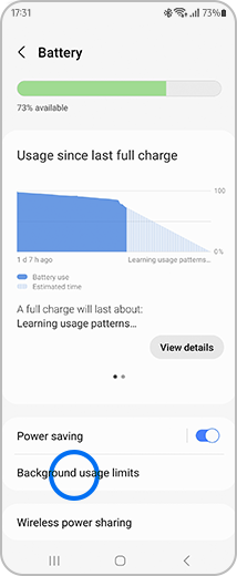 View of "Battery" screen with the "Background usage limits" option highlighted.