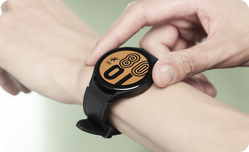 View of a person taking a screenshot on a Galaxy Watch.