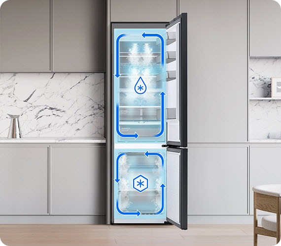 The two doors of the Samsung Bespoke refrigerator are open. Blue arrows that surround the fridge and freezer separately, 2 different icons, and white mist inside the compartments indicate a Twin Cooling System that uses independent evaporators and fans.