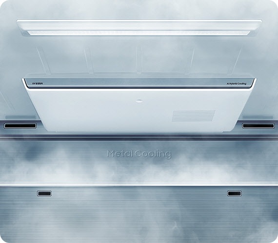 A close-up view of the AI Hybrid Cooling System and Metal Cooling inside the Samsung Bespoke fridge cools a compartment as indicated by white mist.