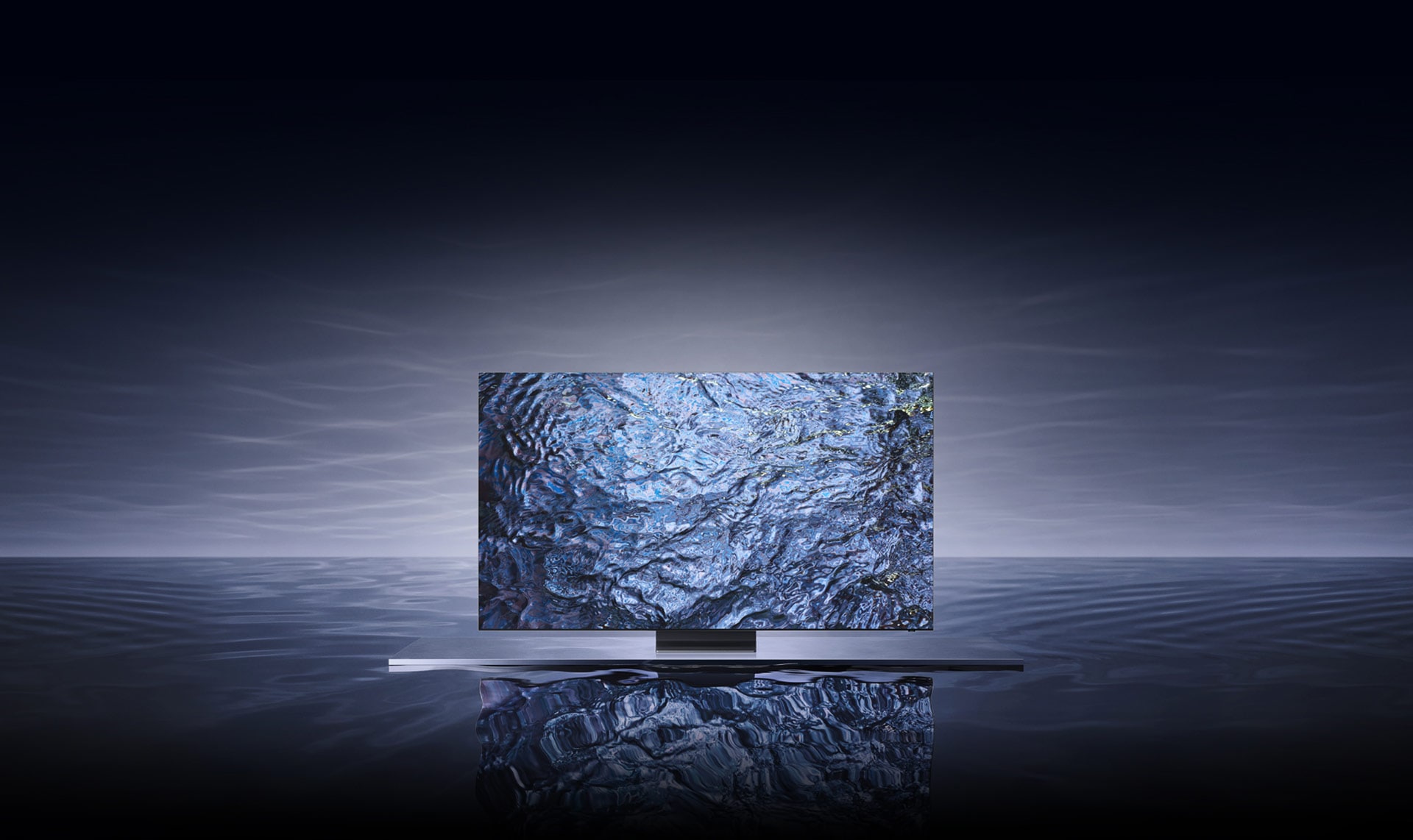 The latest Samsung Neo QLED TV 2023 is floating on top of a water-like gray surface with a gray background.