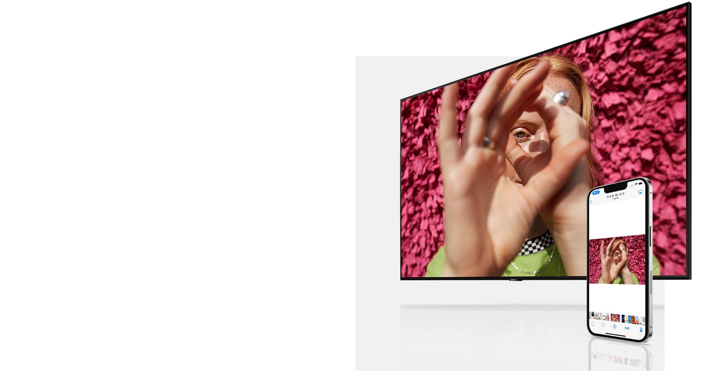 Whatever image is shown on the iPhone's screen simultaneously appears on the Samsung TV. The images change from a woman shown cupping her eyes, a person playing with blocks and a bright yellow chair.