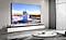 A 98 inch Supersize TV is mounted on a wall in a living room displaying water.