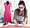 A woman is measuring material