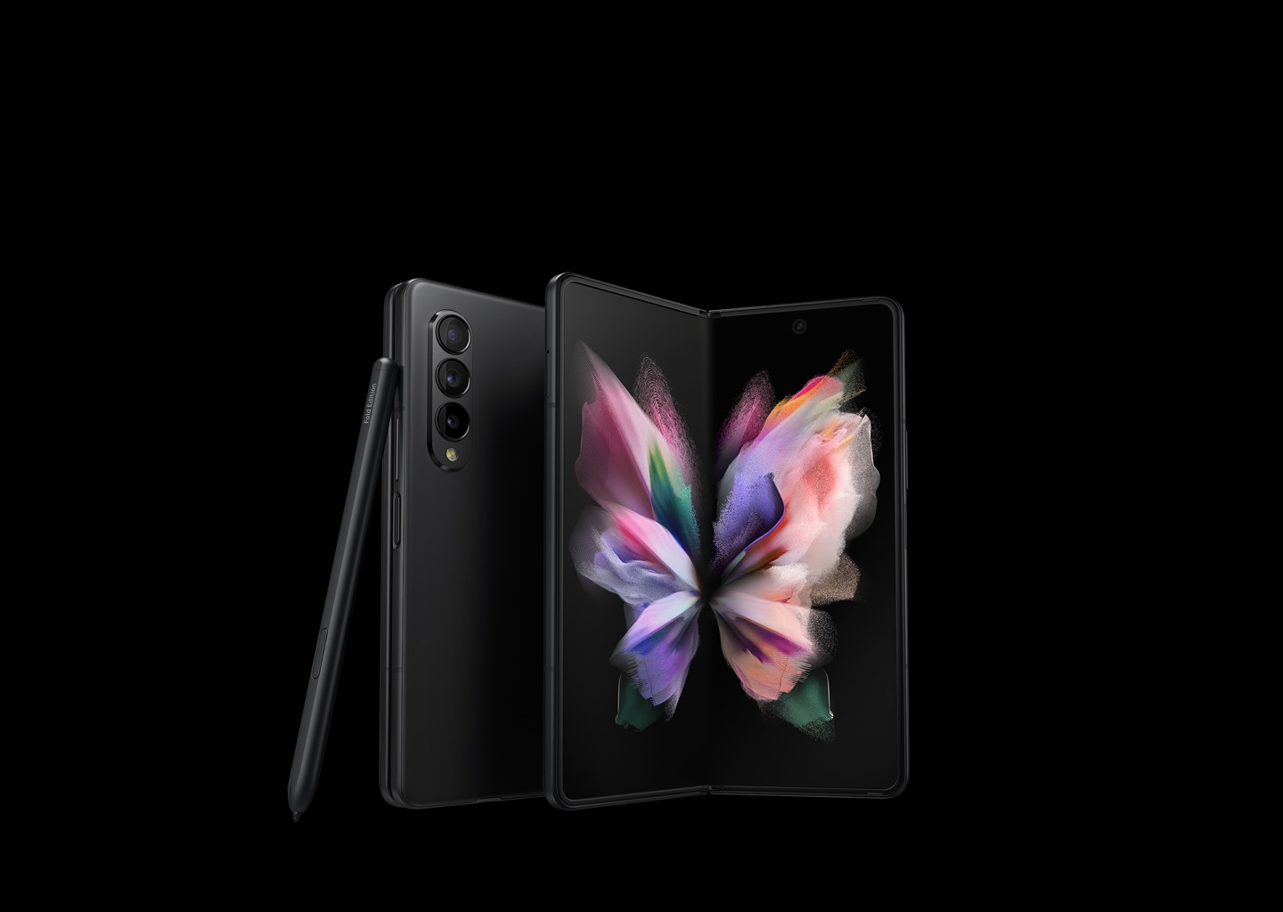 Two Galaxy Z Fold3 5G phones, one seen folded from the Back Cover and one seen unfolded with a colorful wallpaper on the Main Screen. The S Pen Fold Edition leans against the folded phone.